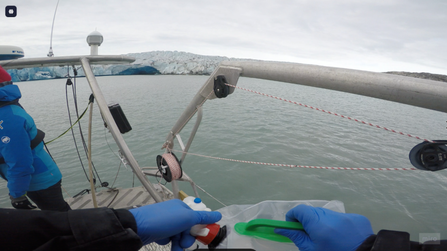 Deploying sampling gear with sterile gloves at the stern